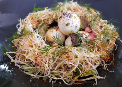 Quails egg birds nest, truffle dressing, asparagus shavings